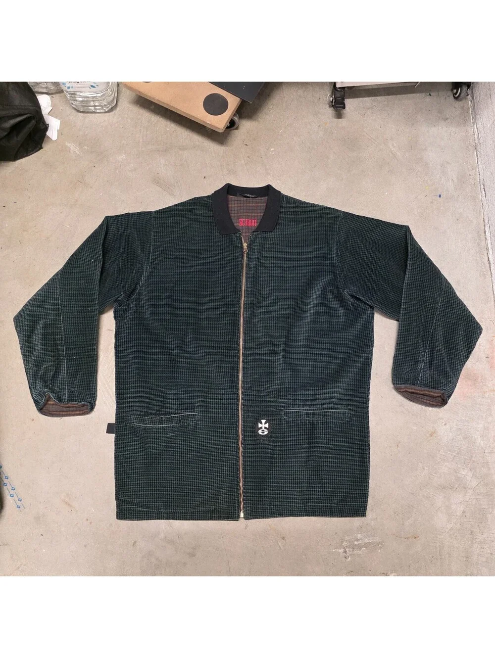 Schroff corduroy jacket features a distinctive green checkered pattern 25x34
